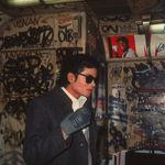 "Michael Jackson stands in a graffiti-filled subway car during the filming of the long-form music video for his song 'Bad,' directed by Martin Scorsese, New York, November 1986."